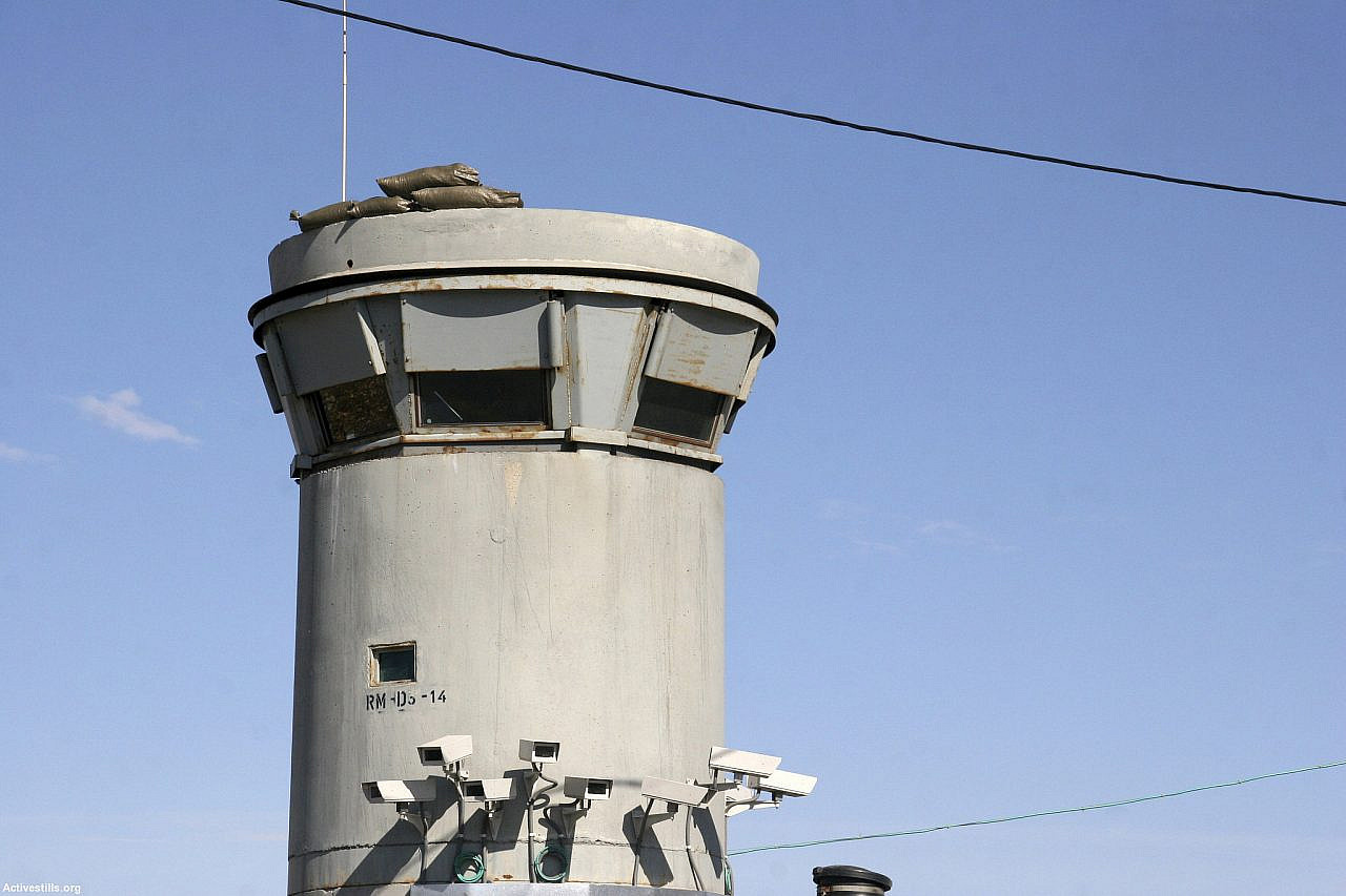 An Israeli military watchtower and cameras over Road 60, occupied West Bank, Jan. 30, 2006. (Activestills)