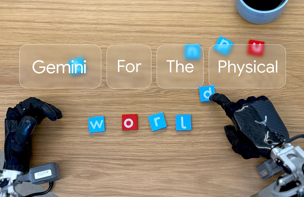 Dos manos robot de DeepMind colocando bloques que dicen "Géminis para el mundo físico."